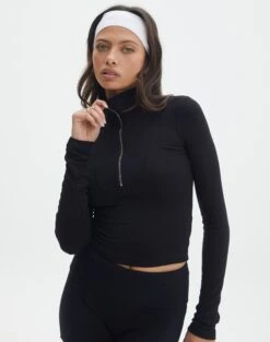 Supersoft Cut Out High Neck Crop Tank 40 Supersoft Cut Out High Neck Crop Tank -Swoon Fashion quinn quarter zip top black front tl93138mod 2